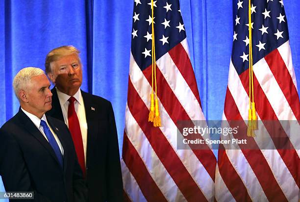 President-elect Donald Trump stands with Vice President-elect Mike Pence at a news conference at Trump Tower on January 11, 2017 in New York City....