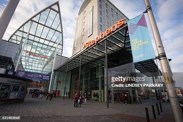 People shop in the St Stephen's shopping centre in Hull, northern England on January 8, 2017. Hull is the UK City of Culture 2017 and will host a...
