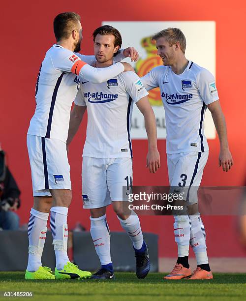 Vedad Ibisevic, Valentin Stocker and Per Skjelbred of Hertha BSC celebrate after scoring the 1:1 during the test match between RCD Mallorca against...