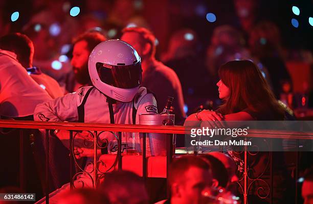 Spectator dressed as 'The Stig' watches the action on Day Five of the BDO Lakeside World Professional Darts Championships at the Lakeside Country...