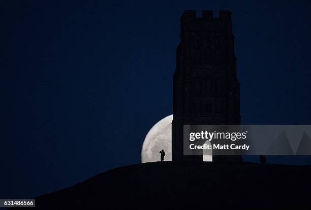 So-called wolf moon rises over Glastonbury Tor on January 11, 2017 in Somerset, England. In some parts of the world, the January full moon is...