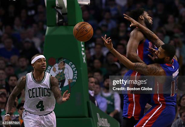 Boston Celtics guard Isaiah Thomas is the happy recipient of the ball after Detroit Pistons center Andre Drummond and Detroit Pistons forward Marcus...