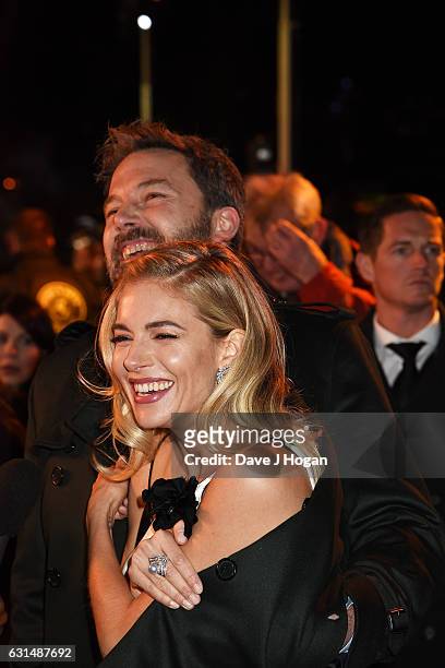 Actor Ben Affleck and Actress Sienna Miller attend the premiere of "Live By Night" at BFI Southbank on January 11, 2017 in London, England.