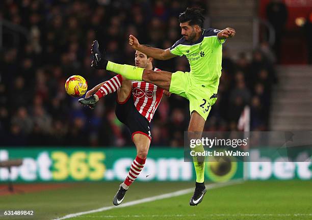 Cedric Soares of Southampton and Emre Can of Liverpool battle for the ball during the EFL Cup semi-final first leg match between Southampton and...