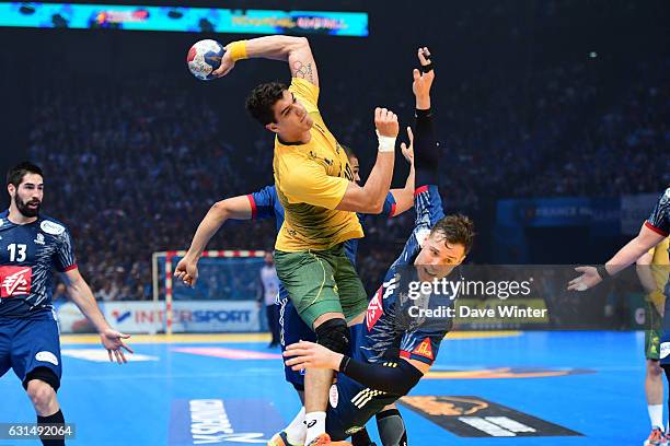 Jose Toledo of Brasil and Kentin Mahe of France during the IHF Men's World Championship match between France and Brazil, Preliminary round, Group A...