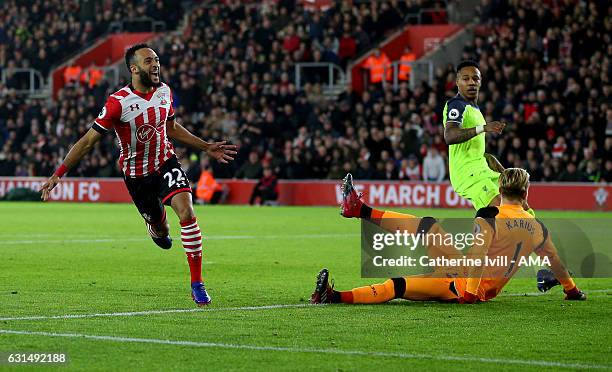 Nathan Redmond of Southampton celebrates past Liverpool goalkeeper Loris Karius after he scores a goal to make it 1-0 during the EFL Cup semi-final...