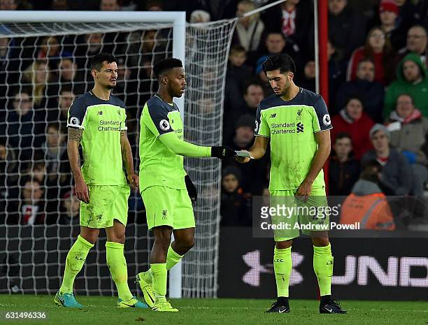 Daniel Sturridge of Liverpool receives a piece of paper from Jurgen Klopp Manager with instructions for the team during the EFL Cup Semi-Final match...