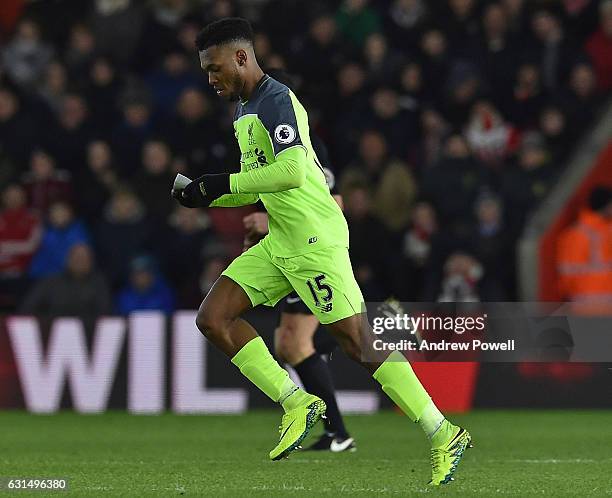 Daniel Sturridge of Liverpool receives a piece of paper from Jurgen Klopp Manager with instructions for the team during the EFL Cup Semi-Final match...