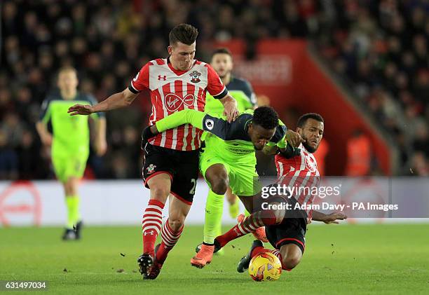 Liverpool's Divock Origi battles for the ball with Southampton's Pierre-Emile Hojbjerg and Ryan Bertrand during the EFL Cup Semi Final, First Leg...