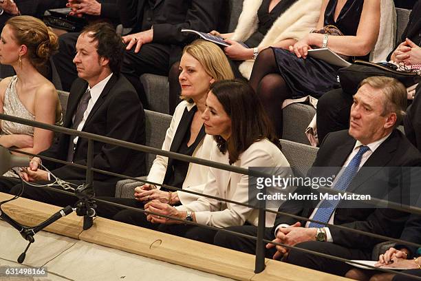 German TV-host Anne Will and her wife Miriam Meckelas listen to a speech as they attend the opening concert of the Elbphilharmonie concert hall on...