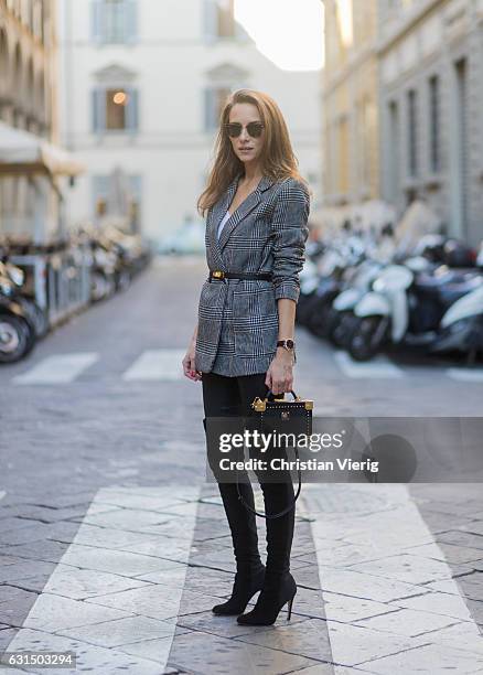 German fashion blogger and model Alexandra Lapp is wearing leather pants from Set, suede overknee boots in black by Gianvito Rossi, off white silk...