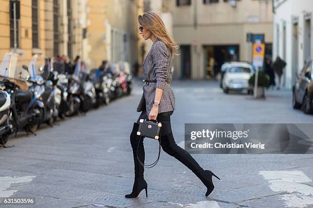 German fashion blogger and model Alexandra Lapp is wearing leather pants from Set, suede overknee boots in black by Gianvito Rossi, off white silk...