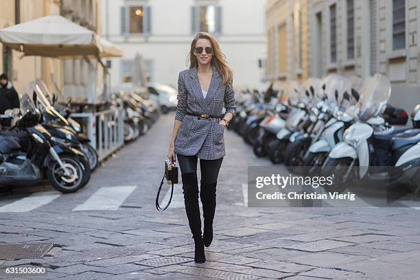 German fashion blogger and model Alexandra Lapp is wearing leather pants from Set, suede overknee boots in black by Gianvito Rossi, off white silk...