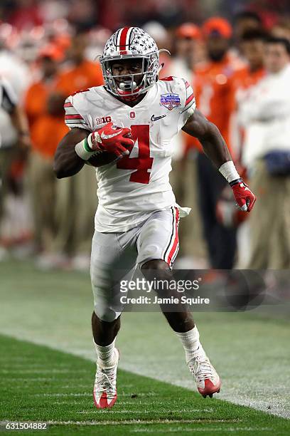 Curtis Samuel of the Ohio State Buckeyes runs with the ball against the Clemson Tigers during the 2016 PlayStation Fiesta Bowl at University of...