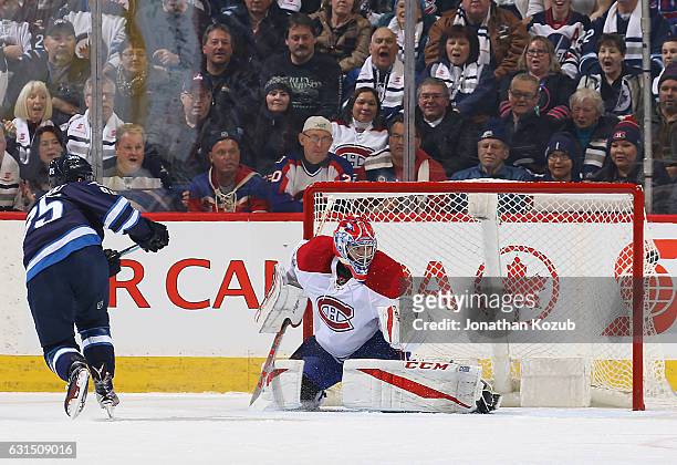 Mathieu Perreault of the Winnipeg Jets bulges the twine behind goaltender Al Montoya of the Montreal Canadiens for a first period goal at the MTS...