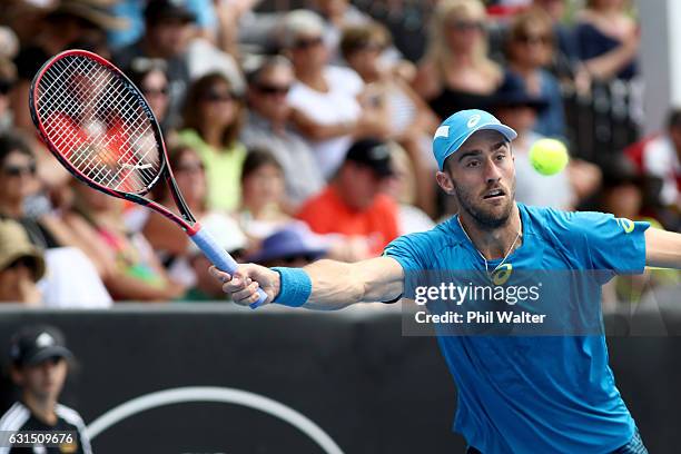 Steve Johnson of the USA plays a return during his mens singles match against John Isner of the USA serves during the ASB Classic on January 12, 2017...