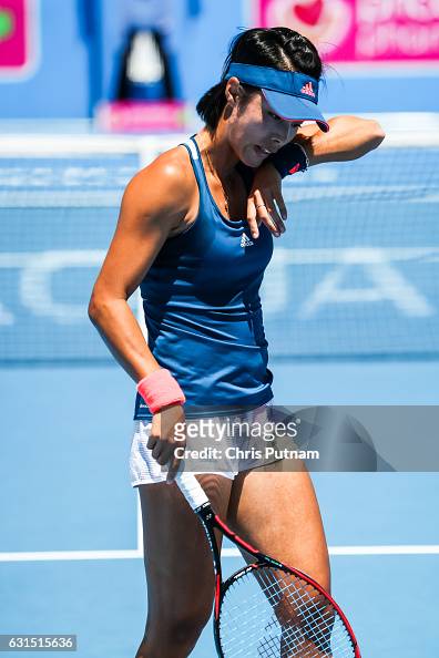 Qiang Wang wipes sweat on a hot Melbourne day whilst playing Destanee ...