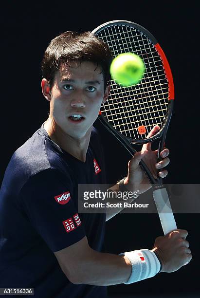 Kei Nishikori of Japan watches the ball during a practice session ahead of the 2017 Australian Open at Melbourne Park on January 12, 2017 in...