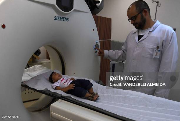 Four-month-old baby Maria Fernanda is examined at the State Brain Institute in Rio de Janeiro, Brazil on January 2, 2017. Maria Fernanda's mother...