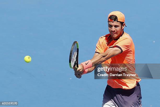 Karen Khachanov of Russia plays a backhand shot in his match against Yoshihito Nishioka of Japan during day three of the 2017 Priceline Pharmacy...