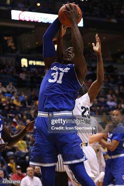 Seton Hall Pirates forward Angel Delgado gets a rebound during an NCAA basketball game between the Marquette Golden Eagles and the Seton Hall Pirates...