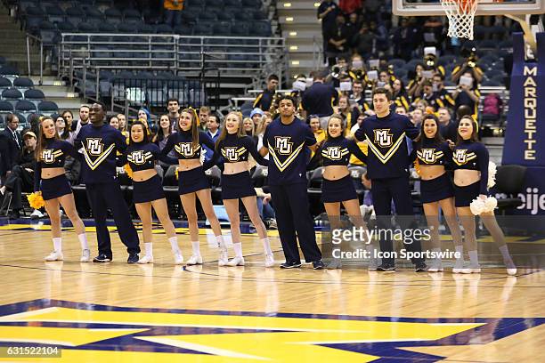 The Marquette Golden Eagles cheerleaders stand together during an NCAA basketball game between the Marquette Golden Eagles and the Seton Hall Pirates...