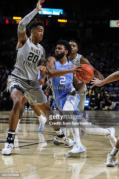 North Carolina Tar Heels guard Joel Berry II drives to the basket covered by Wake Forest Demon Deacons forward John Collins during the second half on...