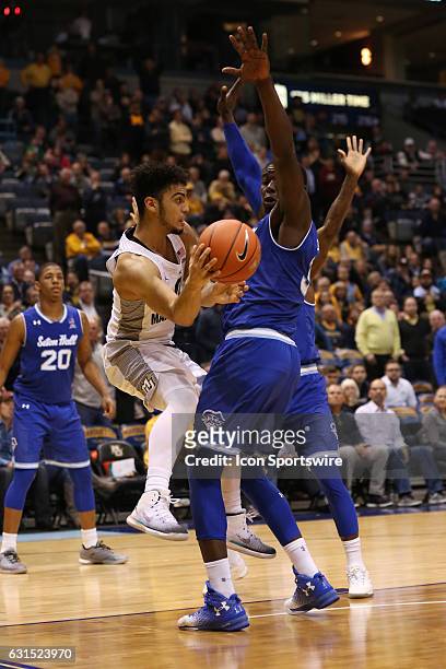 Marquette Golden Eagles guard Markus Howard passes around the defense during an NCAA basketball game between the Marquette Golden Eagles and the...