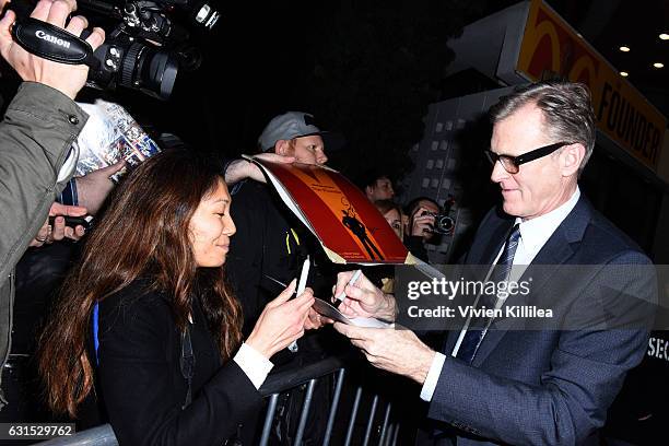 Director John Lee Hancock signs autographs for fans at "The Founder" U.S. Premiere Presented By DeLeon Tequila on January 11, 2017 in Los Angeles,...