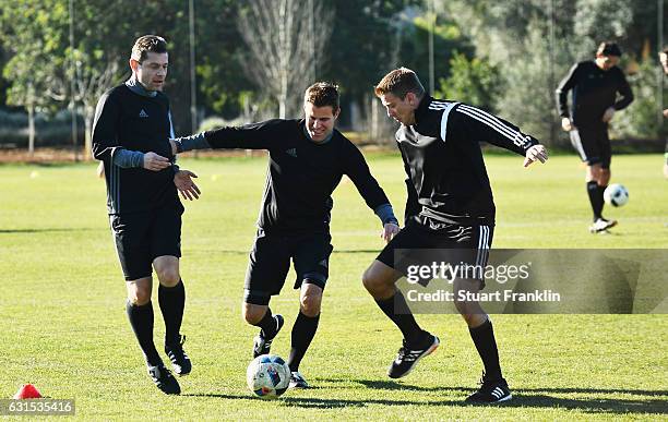 Gunter Perl tackles Felix Brych during the DFB Referee training course at the Hilton hotel on January 12, 2017 in Palma de Mallorca, Spain.