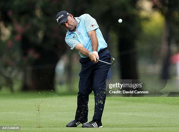 Hennie Otto of South Africa hits his second shot on the 9th hole during day one of The BMW South African Open Championship at Glendower Golf Club on...