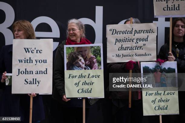 Supporters of John Letts and Sally Lane, parents of Jack Letts who is believed to have left the UK to join Islamic State , hold banners outside the...