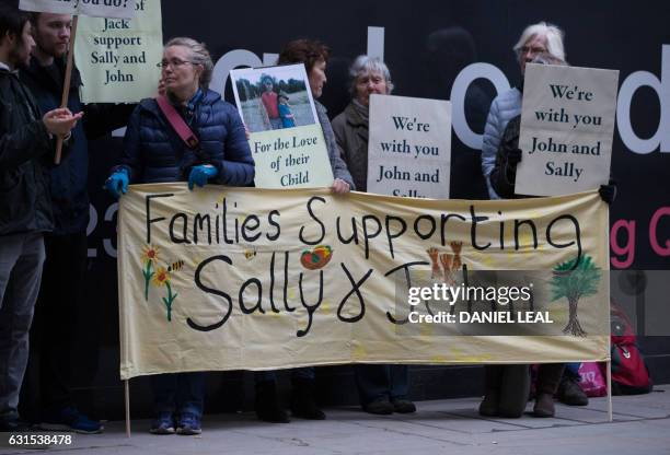 Supporters of John Letts and Sally Lane, parents of Jack Letts who is believed to have left the UK to join Islamic State , hold banners outside the...