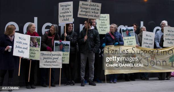 Supporters of John Letts and Sally Lane, parents of Jack Letts who is believed to have left the UK to join Islamic State , hold banners outside the...