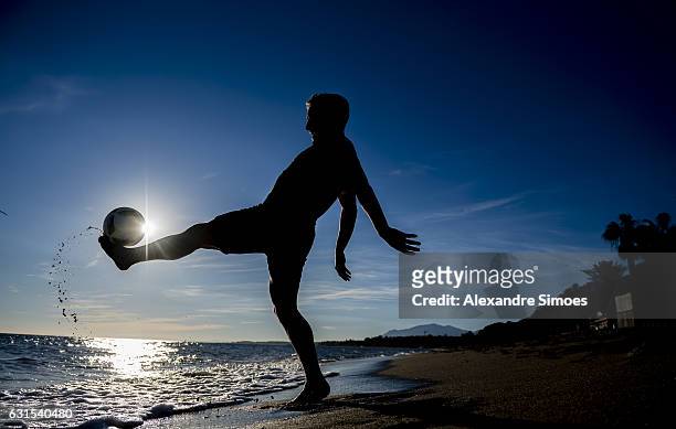 Felix Passlack of Borussia Dortmund plays football on the beach during a training camp on January 11, 2017 in Marbella, Spain.