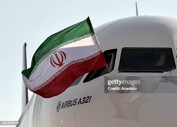 IranAir's passenger plane, Airbus A321, taken delivery of its first of 100 AirBus, lands at the Mehrabad International Airport, in Tehran, Iran on...