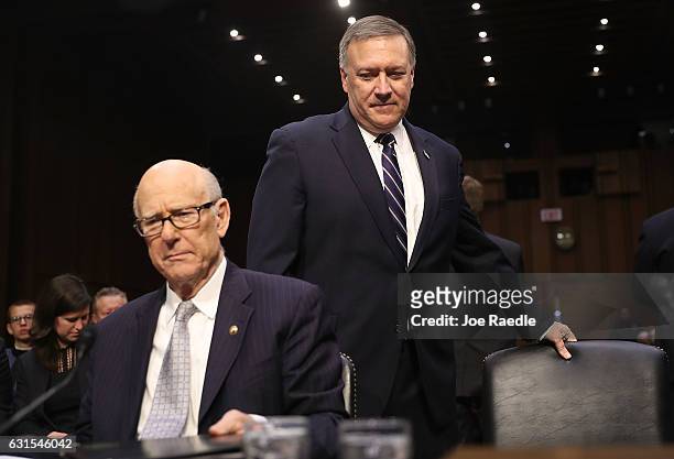Rep. Mike Pompeo prepares to take his seat next to Sen. Pat Roberts as he arrives for his confirmation hearing to be the director of the CIA before...