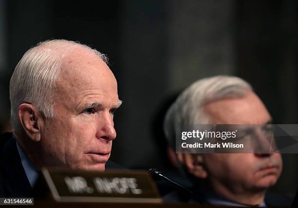 Chairman John McCain , and Sen. Jack Reed , listen to Defense Secretary nominee, retired Marine Corps Gen. James Mattis testify during his Senate...