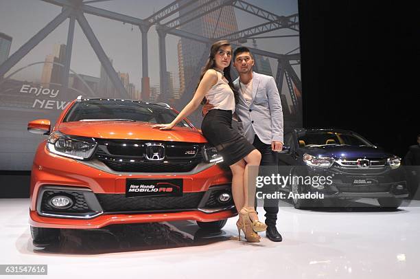 Model Standing as it launches the latest version MPV Mobilio in Jakarta on January 12, 2016. New Mobilio comes with new exterior with three types,...