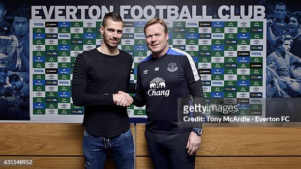 New Everton signing Morgan Schneiderlin is welcomed by Ronald Koeman at USM Finch Farm on January 11, 2017 in Halewood, England.