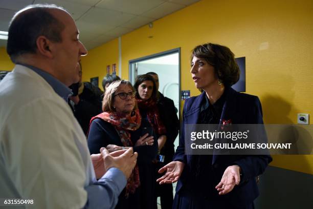 French Minister for Social Affairs and Health Marisol Touraine talks with a doctor as she visits the emergency department of the hospital Trousseau...