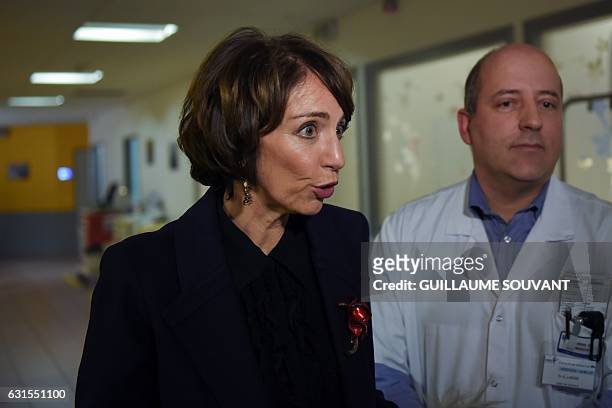 French Minister for Social Affairs and Health Marisol Touraine speaks to the press as she visits the emergency department of the hospital Trousseau...