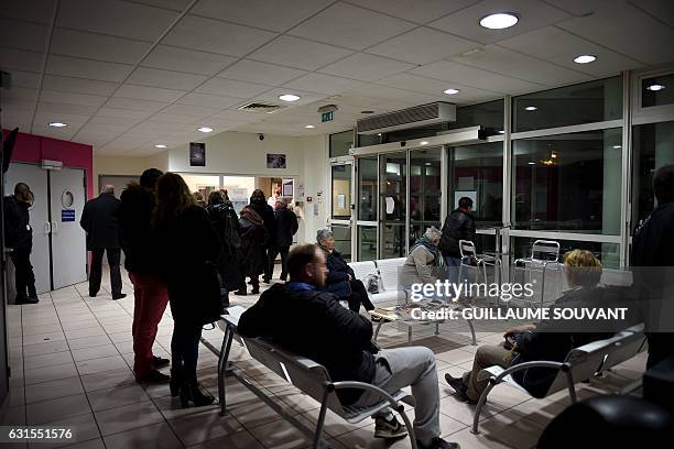 People wait inside the emergency department of the hospital of Trousseau in Tours on January 12, 2017 during a major flu epidemic in France. French...