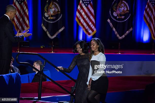 On Tuesday, January 10, U.S. President Barack Obama welcomes his wife, First Lady Michelle Obama, and his daughter, Malia, to the stage, after...