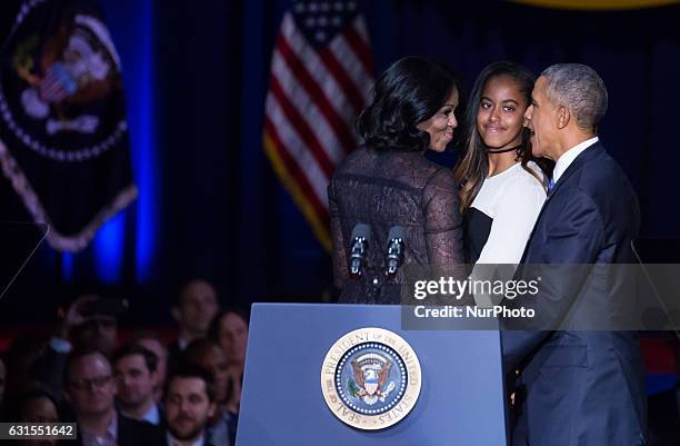 On Tuesday, January 10, , First Lady Michelle Obama, Malia, and U.S. President Barack Obama share a moment talking and laughing onstage, after Obama...