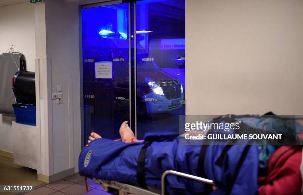 People wait inside the emergency department of the hospital of Trousseau in Tours on January 12, 2017 during a major flu epidemic in France. - French...