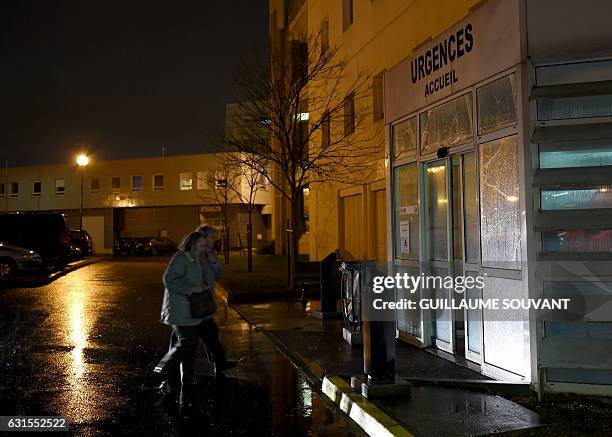 People arrive at the emergency department of the hospital of Trousseau in Tours on January 12, 2017. French hospitals are being stretched to their...