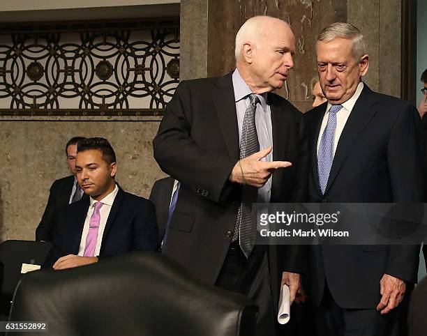Chairman John McCain , stands with Defense Secretary nominee, retired Marine Corps Gen. James Mattis, during his Senate Armed Services Committee...