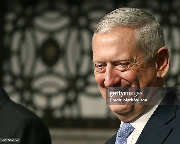 Defense Secretary nominee, retired Marine Corps Gen. James Mattis, smiles during his Senate Armed Services Committee confirmation hearing on Capitol...