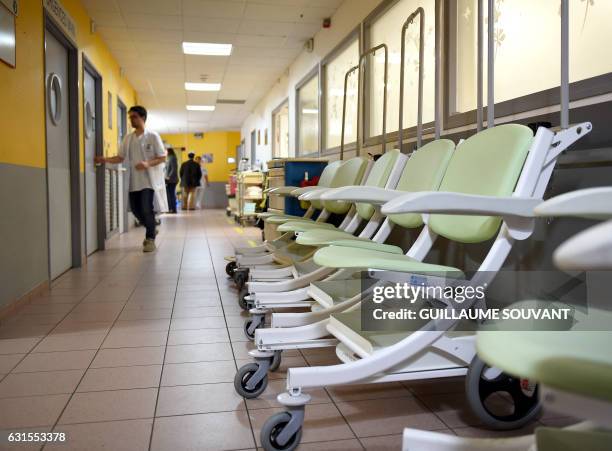 Chairs are put in a corridor of the emergency department of the hospital of Trousseau in Tours on January 12 during a major flu epidemic. French...